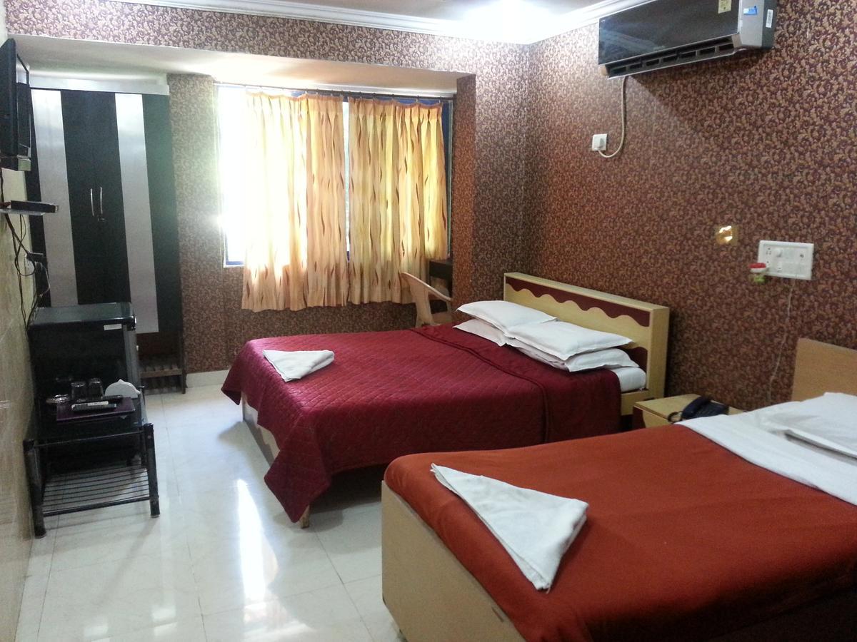 Hotel Sea Sands Bombaim Quarto foto